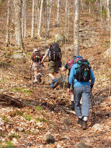 hikers on the trail to Middle Sugarloaf Mountain in New Hampshire