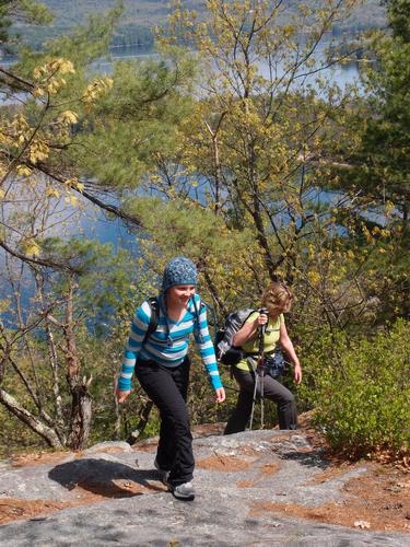 hikers on Sugarloaf Mountain near Newfound Lake in New Hampshire