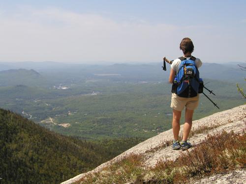 hiker and view from North Percy Peak in New Hampshire