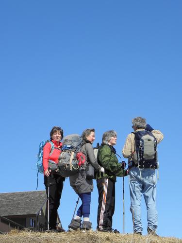 hikers atop Mount Sunapee in New Hampshire
