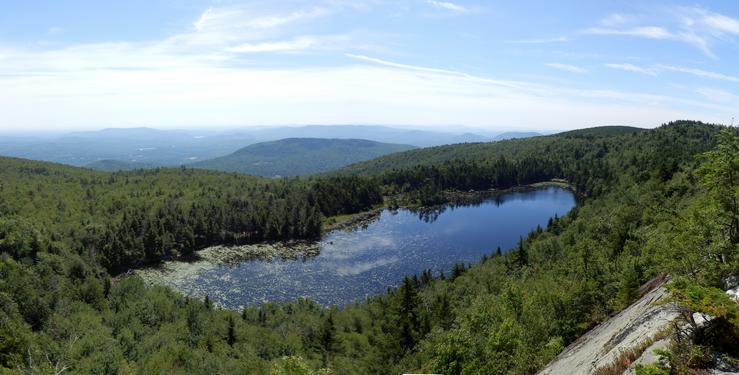 view in July from White Ledges overlooking Lake Solitude on Mount Sunapee in New Hampshire