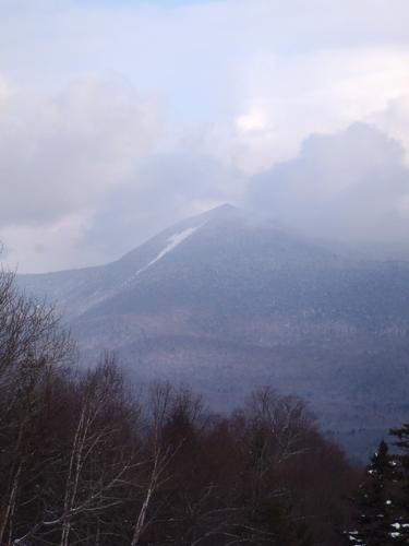 stormy winter view of North Tripyramid from Mount Tecumseh in New Hampshire