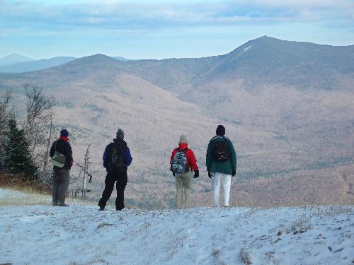 hikers and view from Mount Tecumseh in New Hampshire