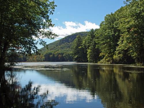 view of the shoulder of Mount Toby rising above Cranberry Pond in western Massachusetts