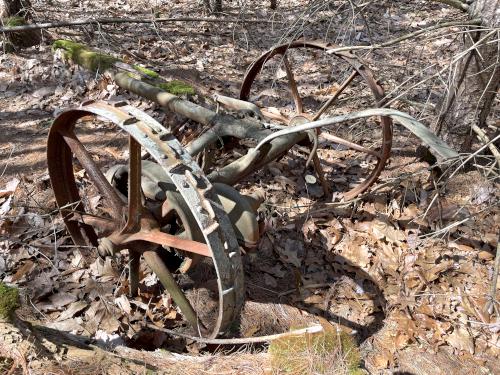 old farm machinery in March at Little Tooky Trail near Hopkinton in southern New Hampshire