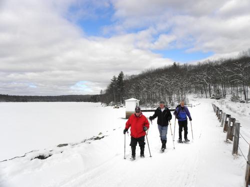 winter hikers at Tower Hill Pond in New Hampshire