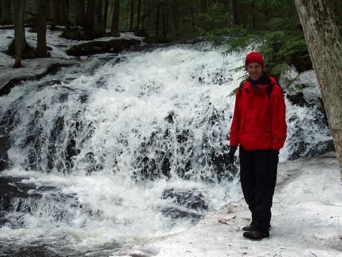 hiker in Tucker Brook Town Forest in New Hampshire