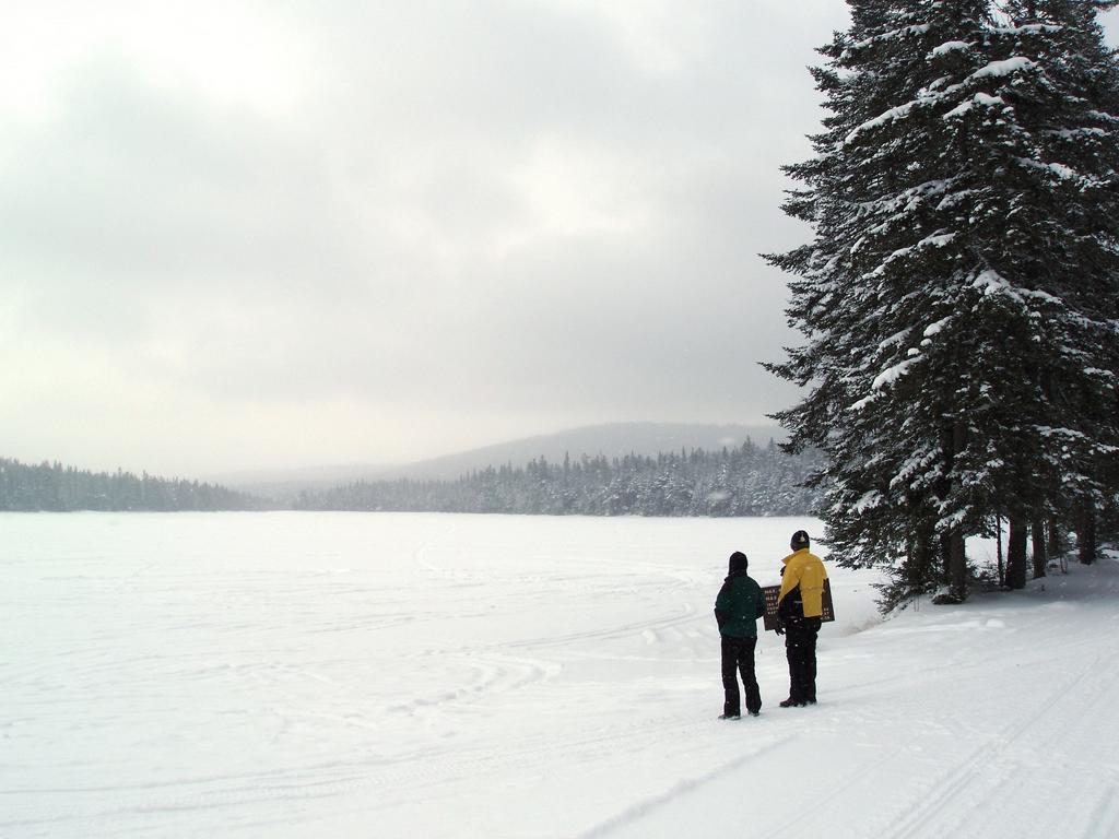Marianne and Dick check out Little Diamond Pond in January near Tumble Dick Mountain in northern New Hampshire