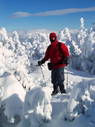 a winter hiker atop North Twin Mountain in New Hampshire