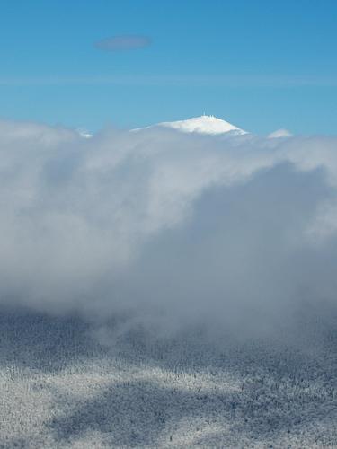 Mount Washington peaks above the clouds as seen from North Twin Mountain in New Hampshire