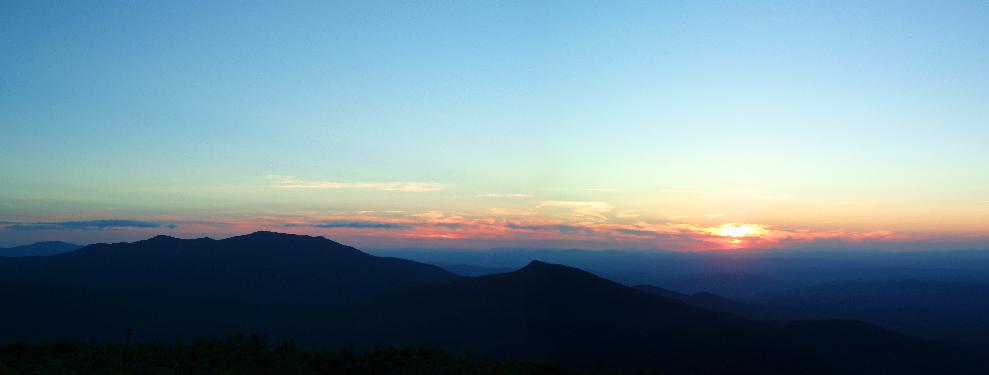 Sunset over Franconia and Garfield ridges as seen from the summit of South Twin Mountain in NH on August 2005