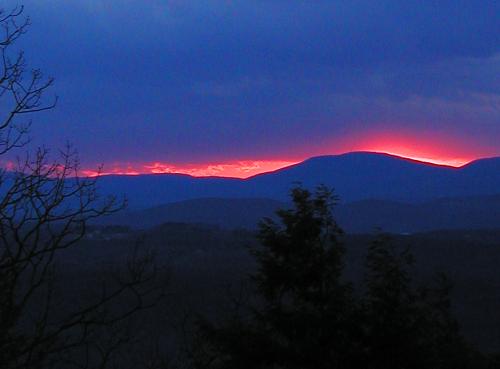 fiery sunset in December as seen from North Uncanoonuc Mountain in New Hampshire