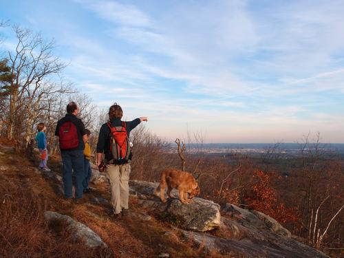 hikers at the south-facing outlook on South Uncanoonuc Mountain in New Hampshire