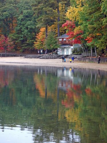 fall color surrounds visitors to Walden Pond State Reservation at Concord in Massachusetts