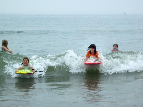 young surfers at Wallis Sands State Beach in New Hampshire