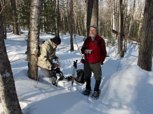 David and John switching to snowshoes in February at Walter-Newton Conservation Trails in New Hampshire