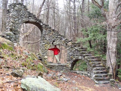 Fred holds up an arch at Madame Sherri Forest castle ruins near Wantastiquet Mountain in southwestern New Hampshire