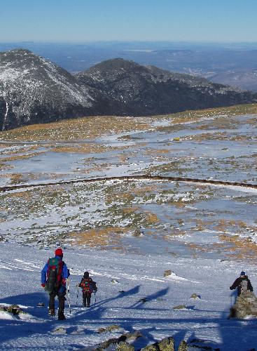 February hikers descending Mount Washington in New Hampshire