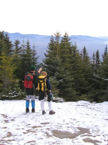 hikers and winter view on Mount Starr King in New Hampshire
