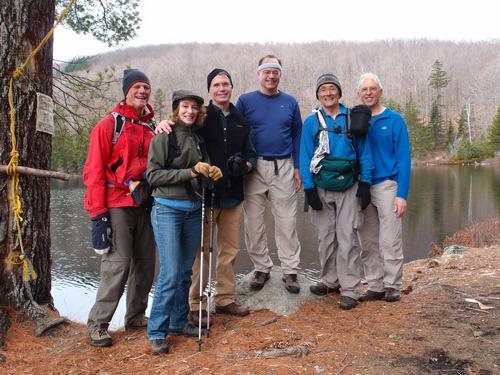 hikers at Wachipauka Pond on the way to Webster Slide Mountain in New Hampshire
