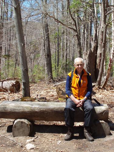 hiker relaxing on the woods trail to Dickey Mountain in New Hampshire
