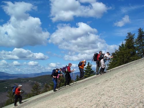 hikers in May headed up-slap toward Welch Mountain in New Hampshire