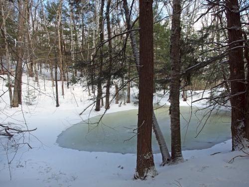 pond in March near West Hill at Horatio Colony near Keene in southwestern New Hampshire
