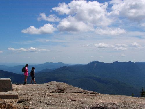 hikers and view from Mount Osceola in New Hampshire