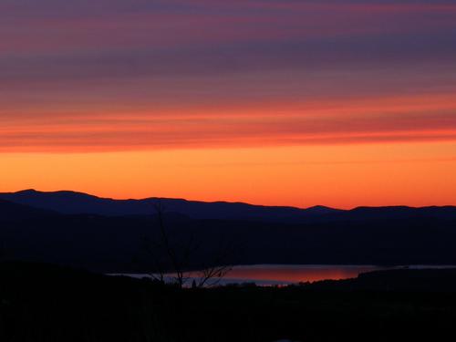 orange sunset as seen from Whiteface Mountain near Lake Winnipesaukee in New Hampshire