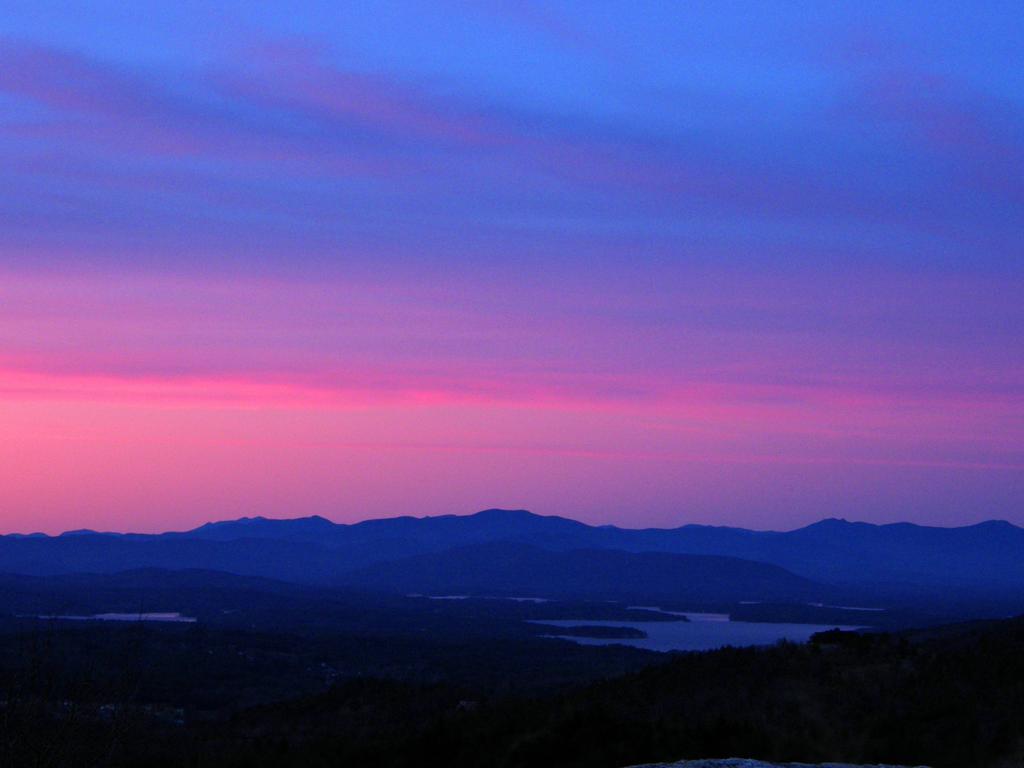 pink sunset as seen from Whiteface Mountain near Lake Winnipesaukee in New Hampshire
