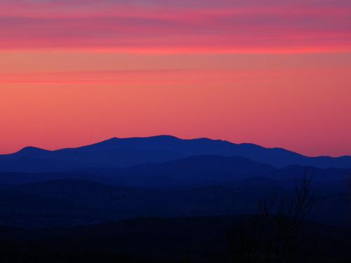 red sunset as seen from Whiteface Mountain near Lake Winnipesaukee in New Hampshire
