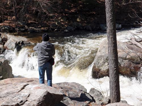hiker at Wildcat Falls in southern New Hampshire