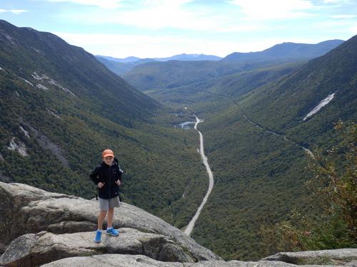 Carl stands out on Mount Willard's ledge overlooking Crawford Notch in New Hampshire