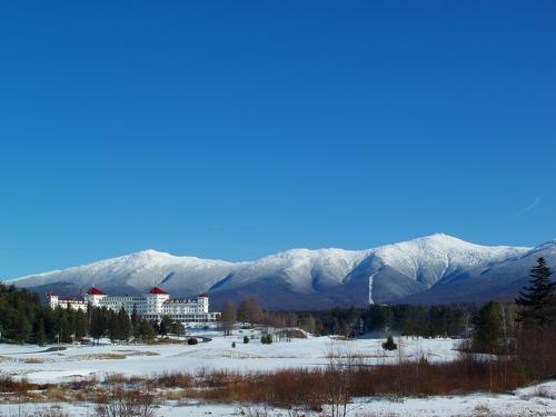 view of the Mount Washington Hotel and Presidential Range in December as seen from Route 302 in New Hampshire