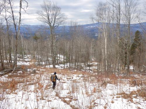winter bushwhacker descending Willoughby Mountain in New Hampshire