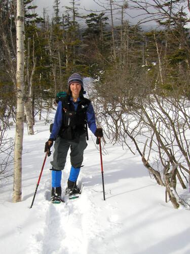 snowshoe hiker on the trail to Mount Wolf in New Hampshire