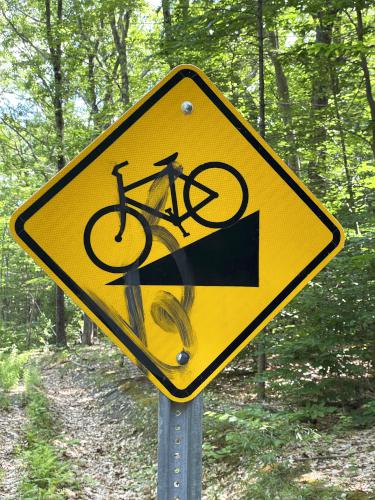 trail warning sign in June at WOW Rail Trail in central New Hampshire