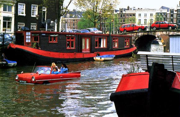 postcard of unusual watercraft in a canal in Holland in April 1996