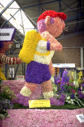 colorful hiker as part of the local flower parade in Holland in April 1996