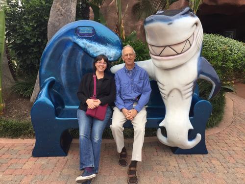Linda and Fred sitting with a shark outside the Aquarium restaurant at Kemah Boardwalk near Houston, Texas