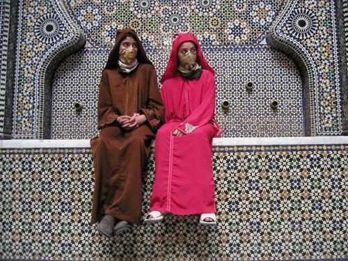 models posing before a mosaic fountain in Morocco