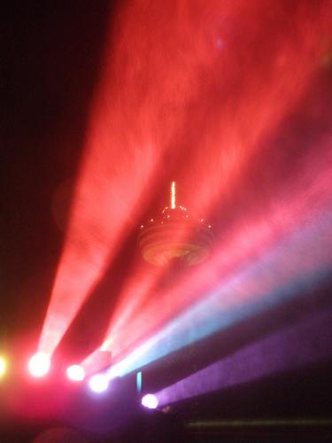 searchlights color the falls spray as seen from the Canadian side of Niagara Falls