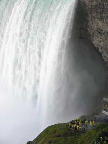 thrill seekers in yellow-slicker uniforms watch Niagara Falls up close from the Canadian side
