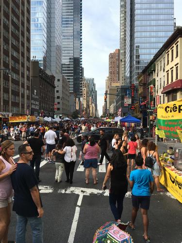 street market and crowd in July at New York City