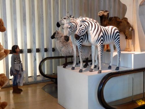 stuffed zebras by the escalator at the F.A.O. Schwarz store in New York City
