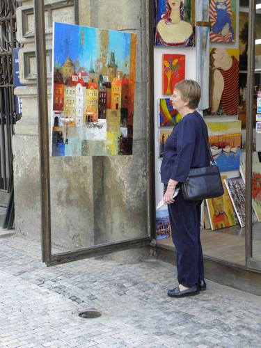 tourist in front of an art store at Prague in the Czech Republic