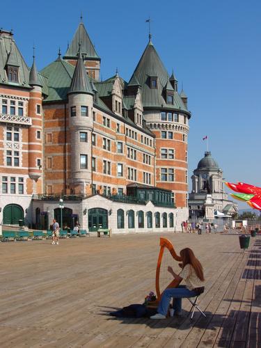 harpist on Dufferin Terrace before Chateau Frontenac in Quebec City, Canada
