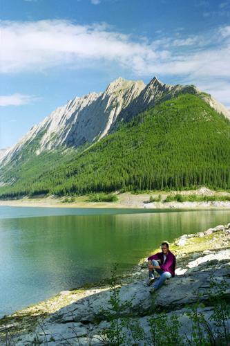 David relaxes on the lakeside with one of the famously-peaked Rockies in the background in August 1996