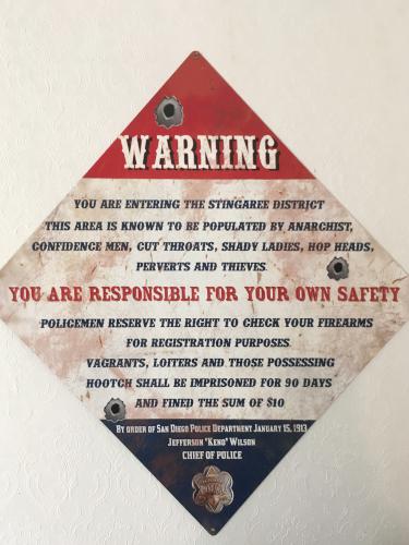 historic warning sign displayed at the Davis-Horton House in San Diego, California