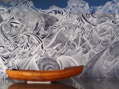 wooden boat and Encounter of Waters mural inside the visitors center at Seattle in Washington